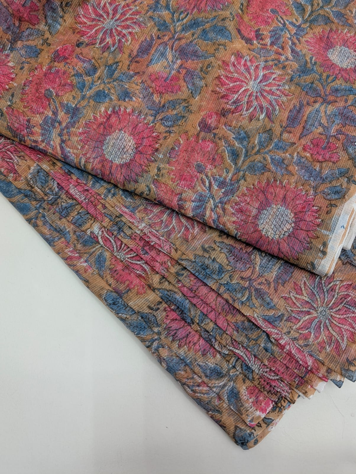 Camel brown hand block printed Kota Doriya cotton fabric with large pink and slate blue dahlia floral pattern — Bagru print running fabric Jaipur