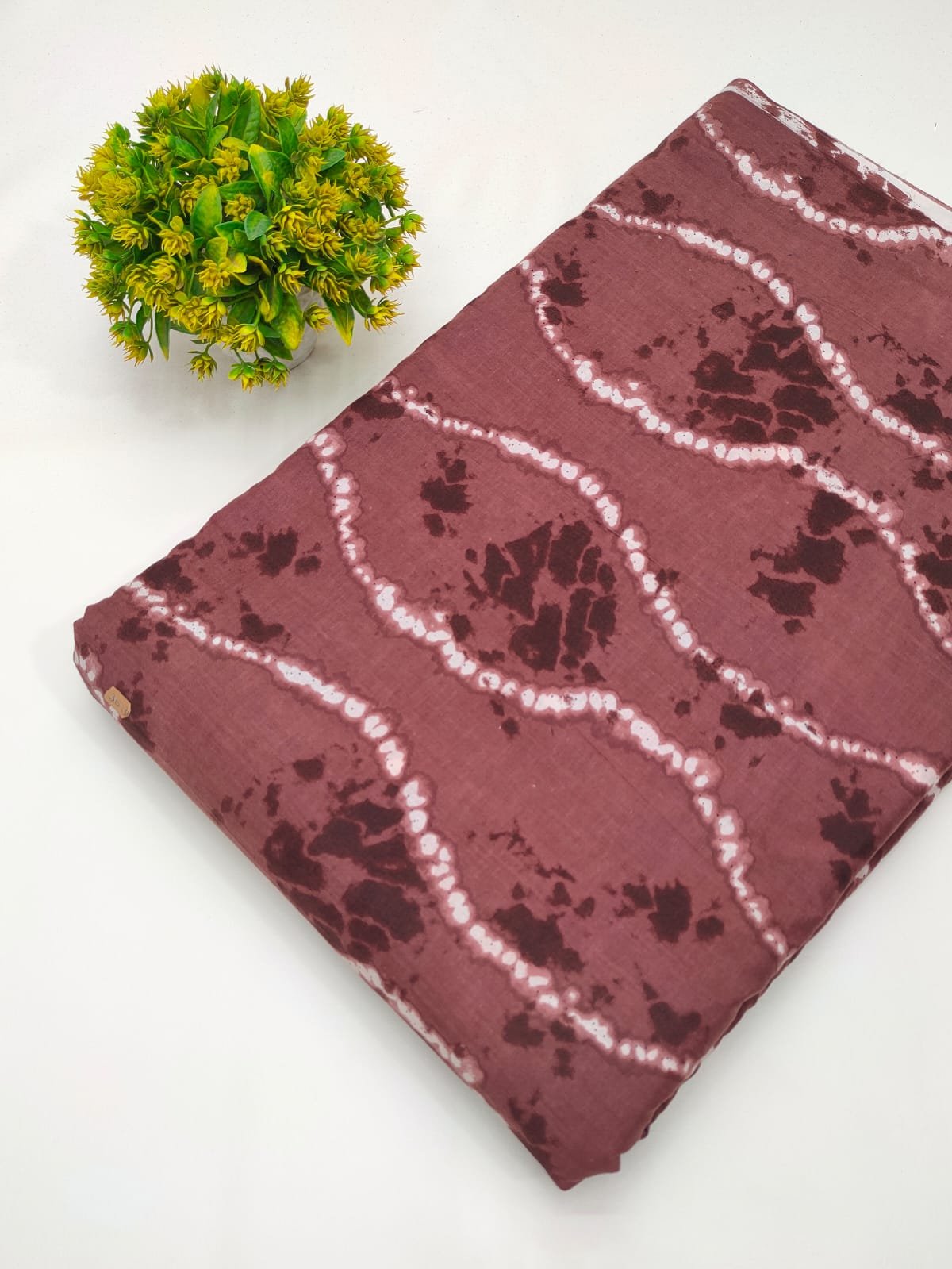 Maroon abstract screen print cotton fabric India