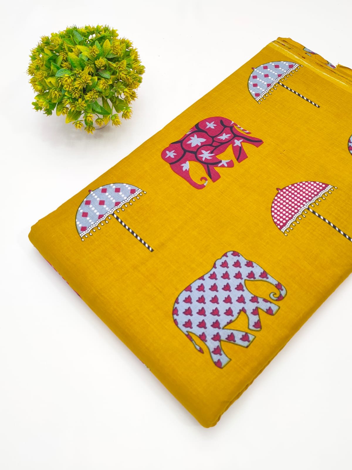 Yellow cotton fabric with elephant umbrella print