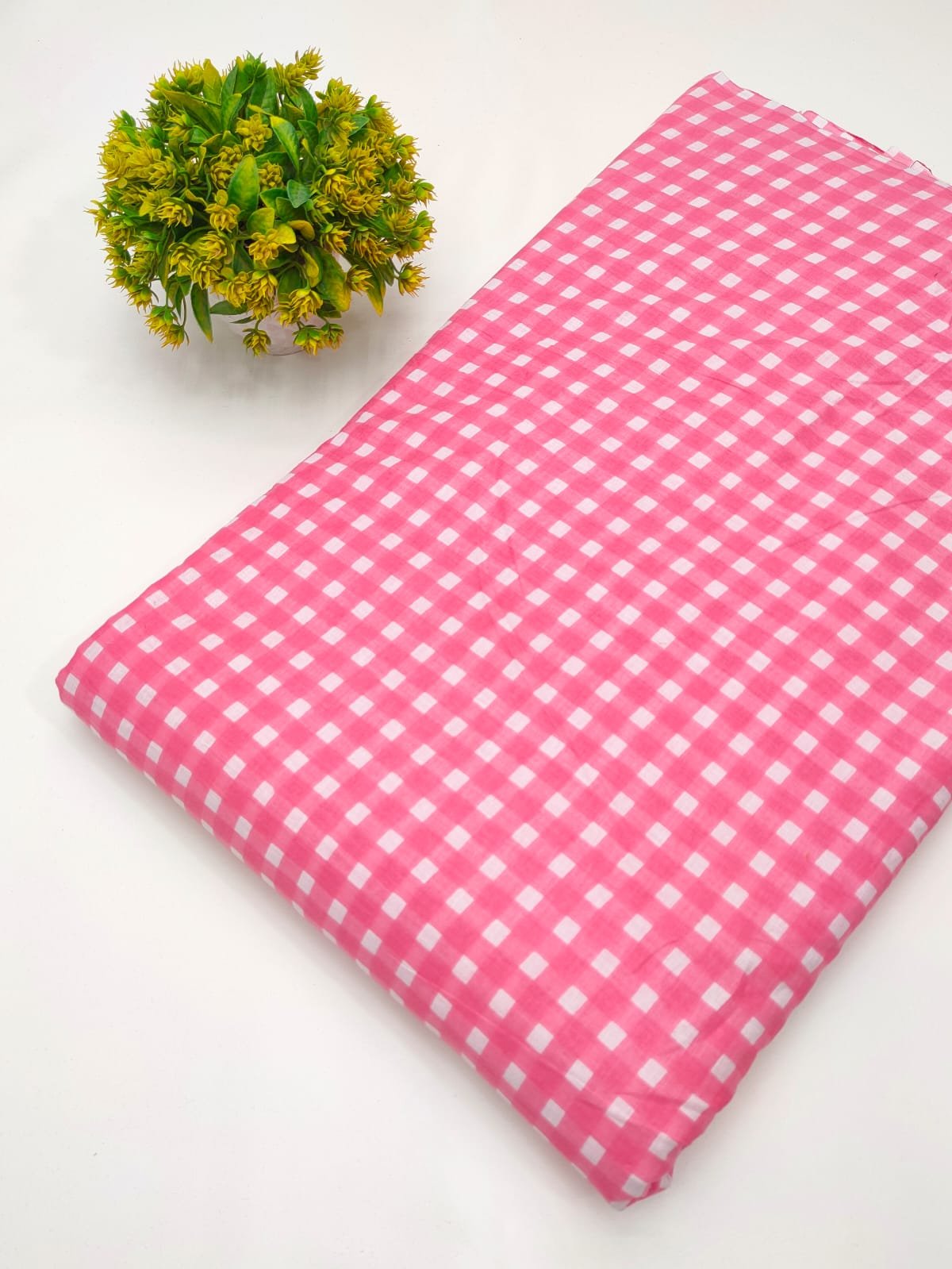 Pink gingham screen printed cotton fabric India
