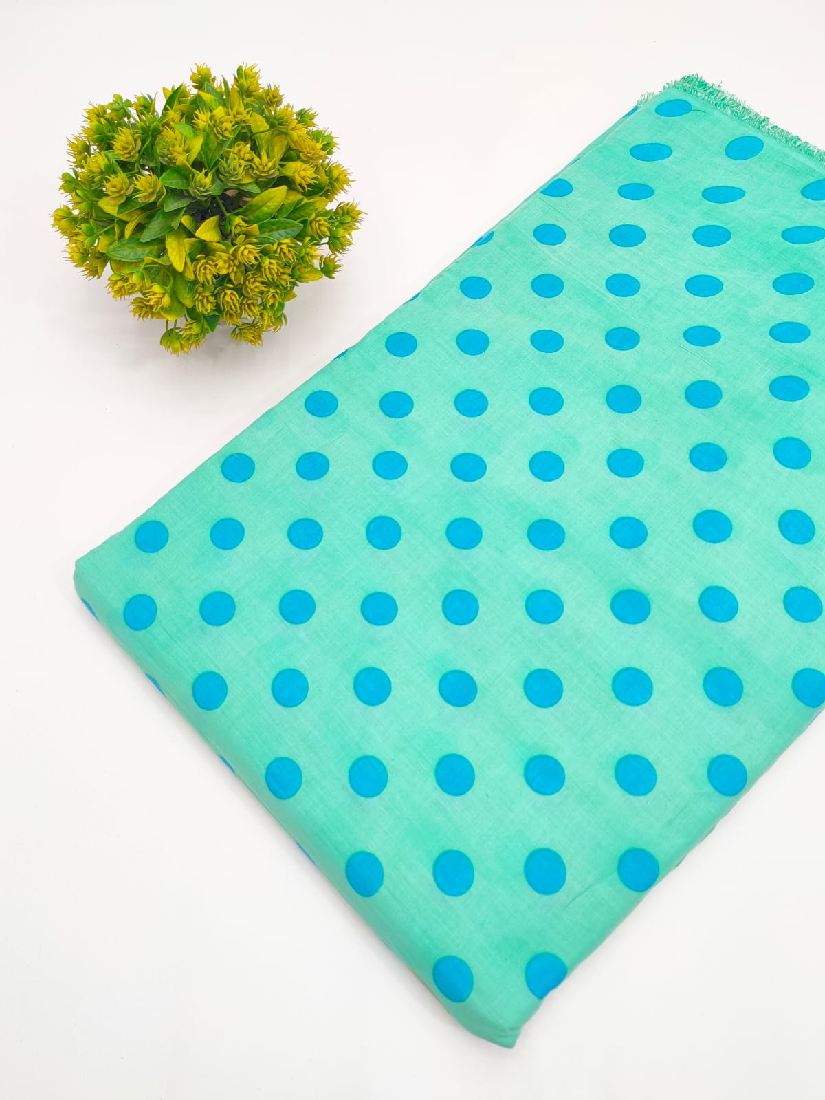 Sea green and blue polka dot screen print pure cotton fabric India