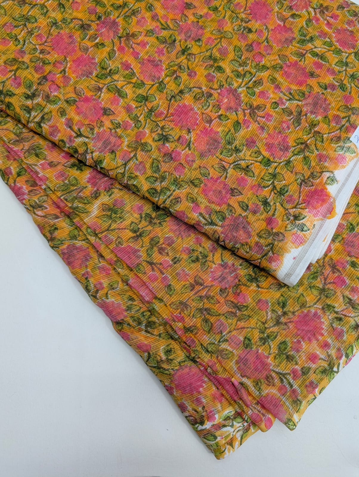 Mustard yellow hand block printed Kota Doriya cotton fabric with pink rose floral and olive green vine pattern - Sanganeri print running fabric