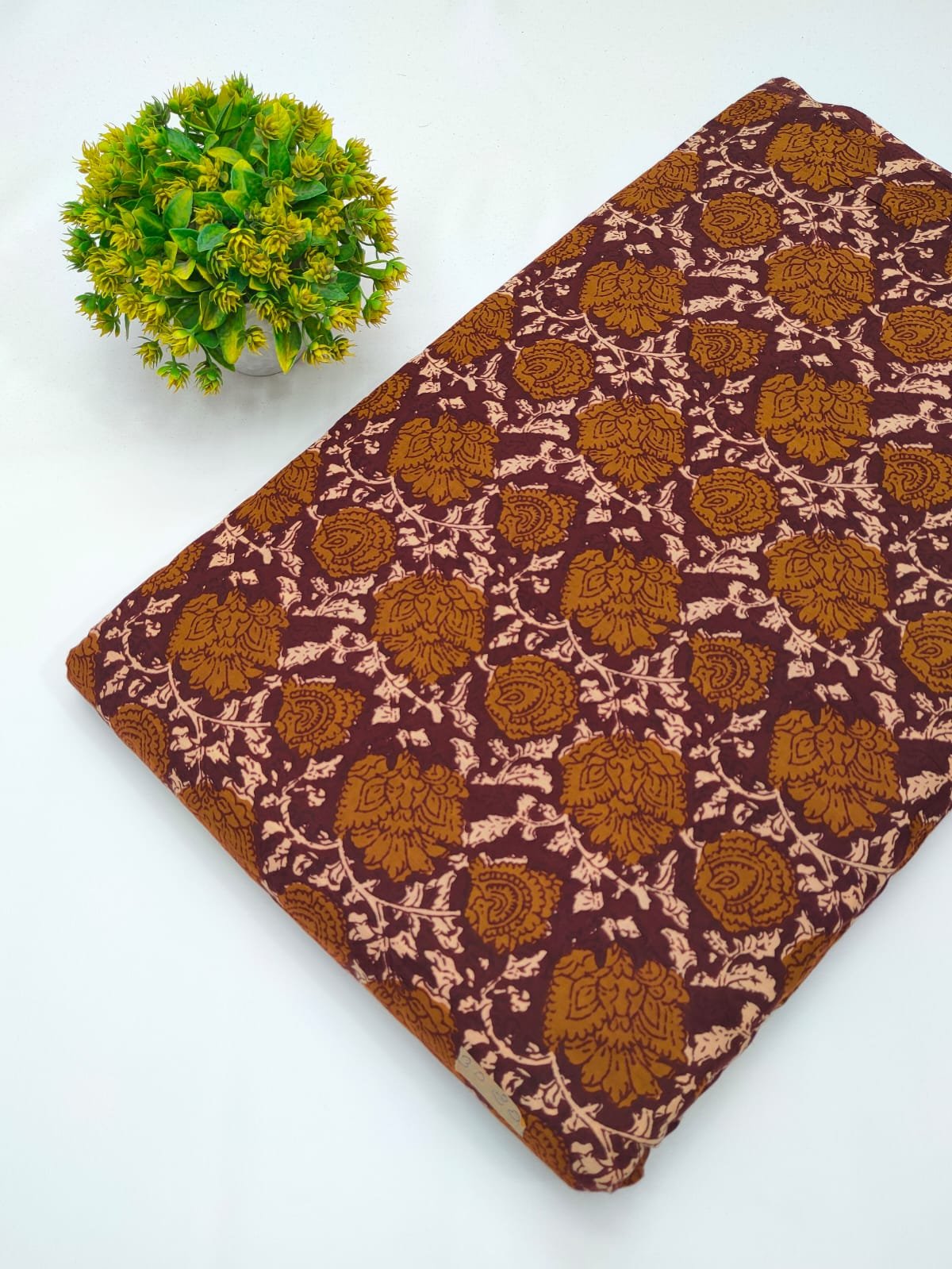 Brown ethnic motif screen printed cotton fabric India