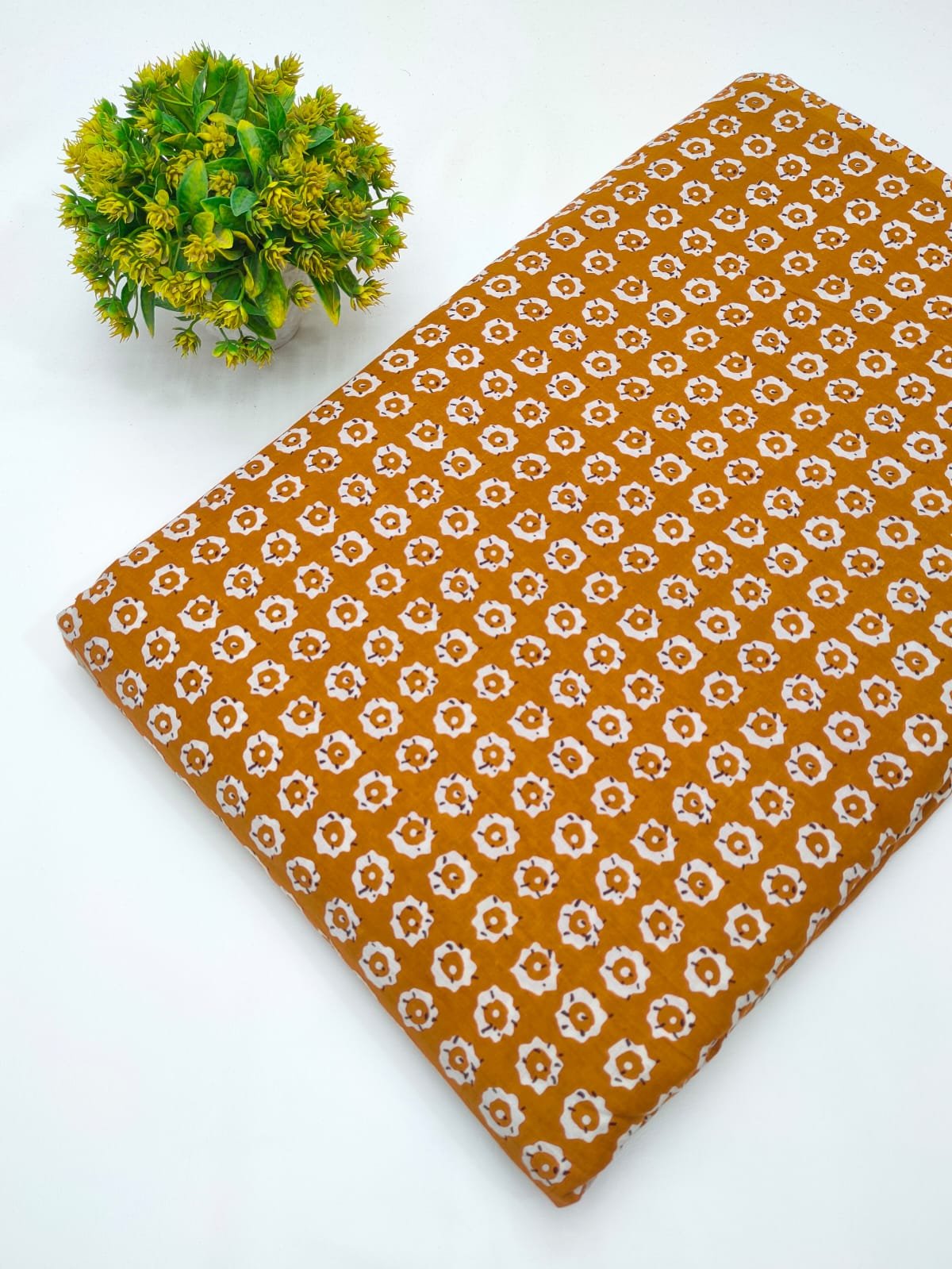 Orange ethnic motif screen print cotton fabric