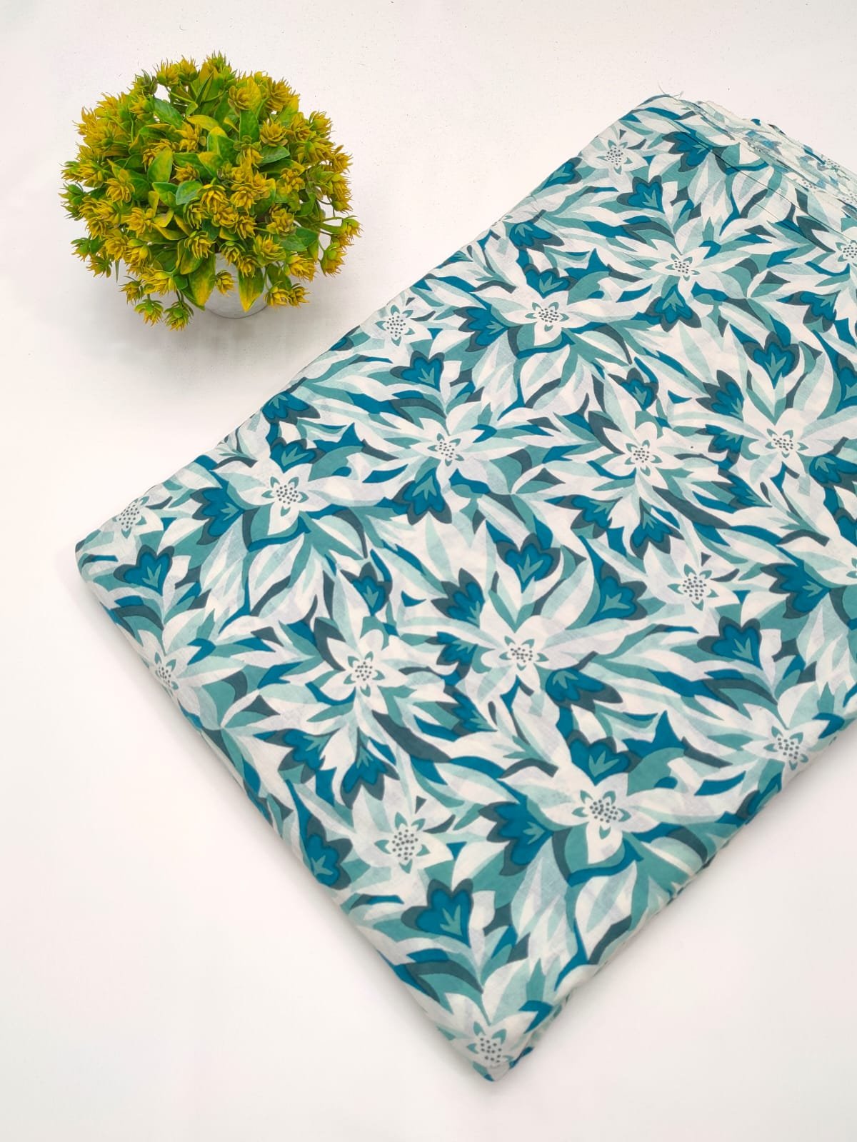 White and teal floral screen print cotton fabric