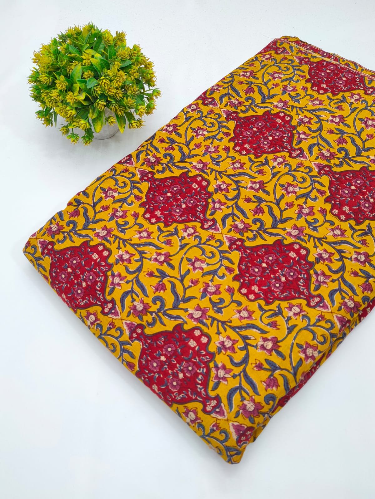 Yellow-red ethnic motif cotton fabric India