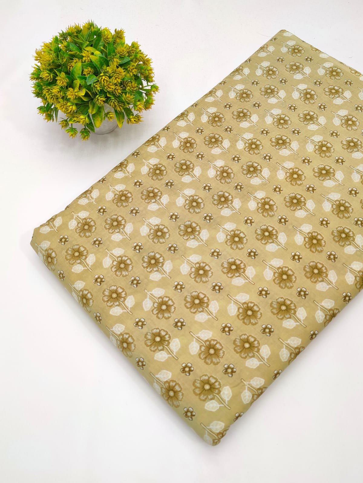 Beige fabric with subtle floral screen print design