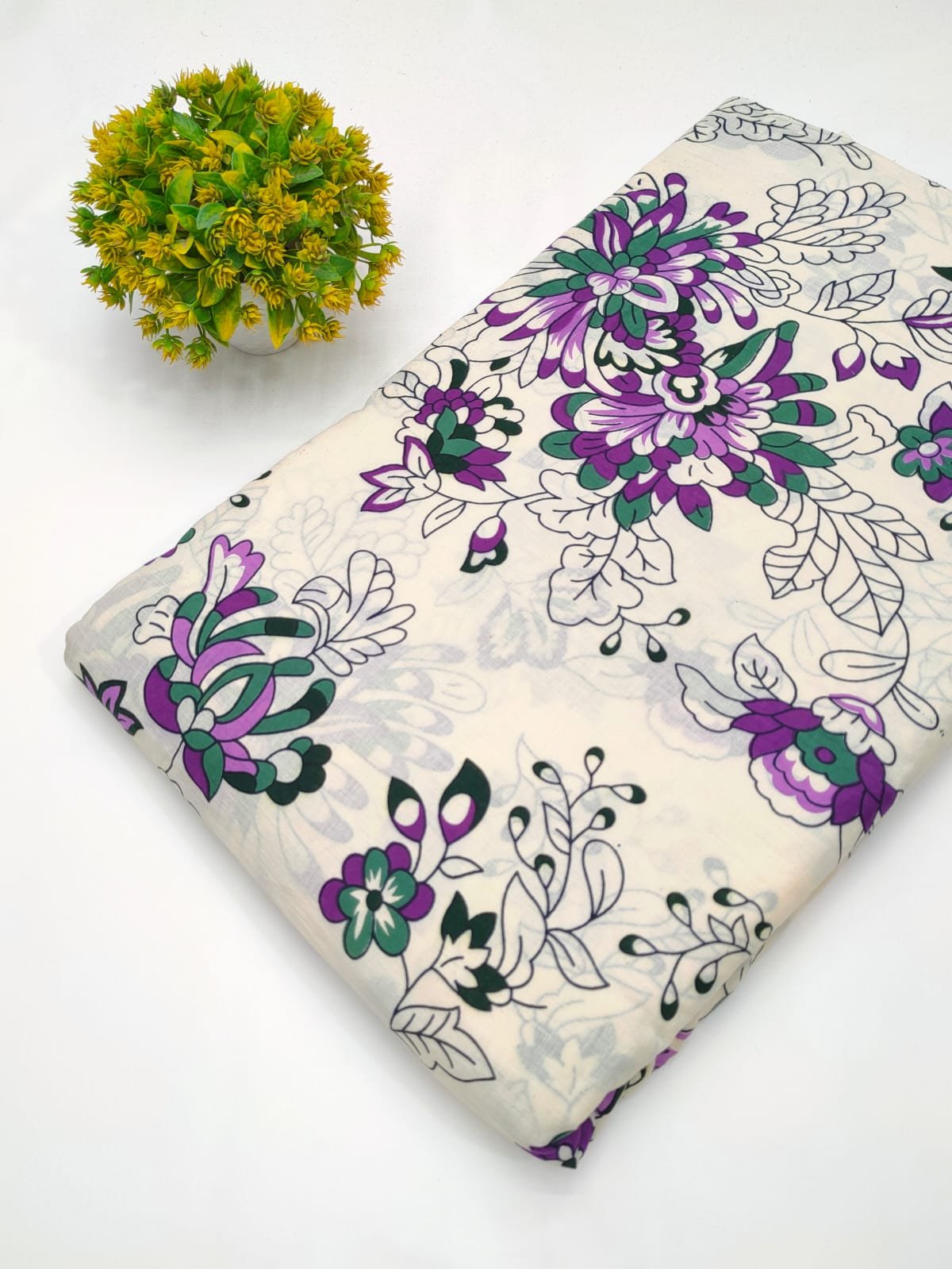 White cotton fabric with purple floral design