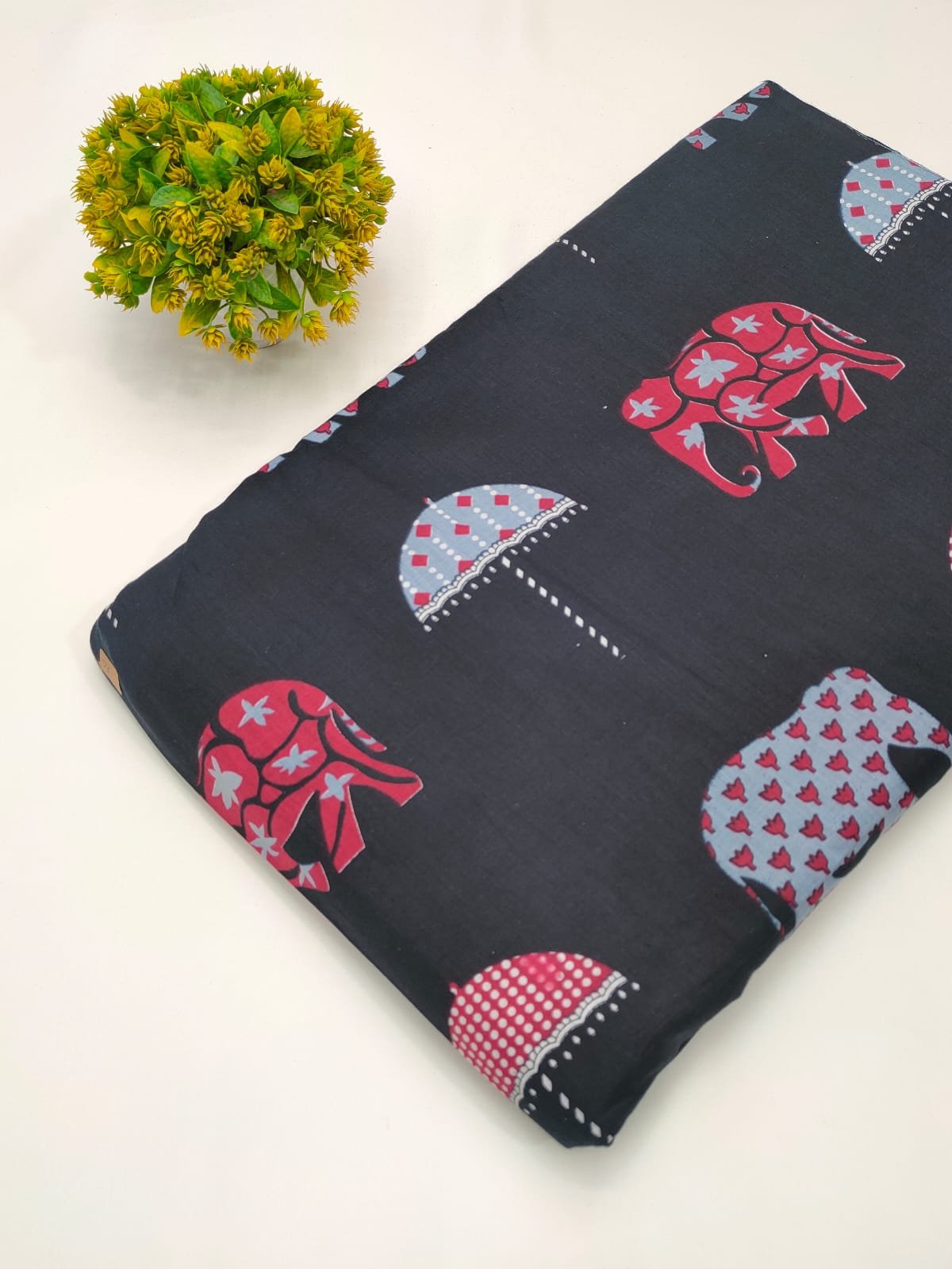 Black elephant motif screen printed cotton fabric