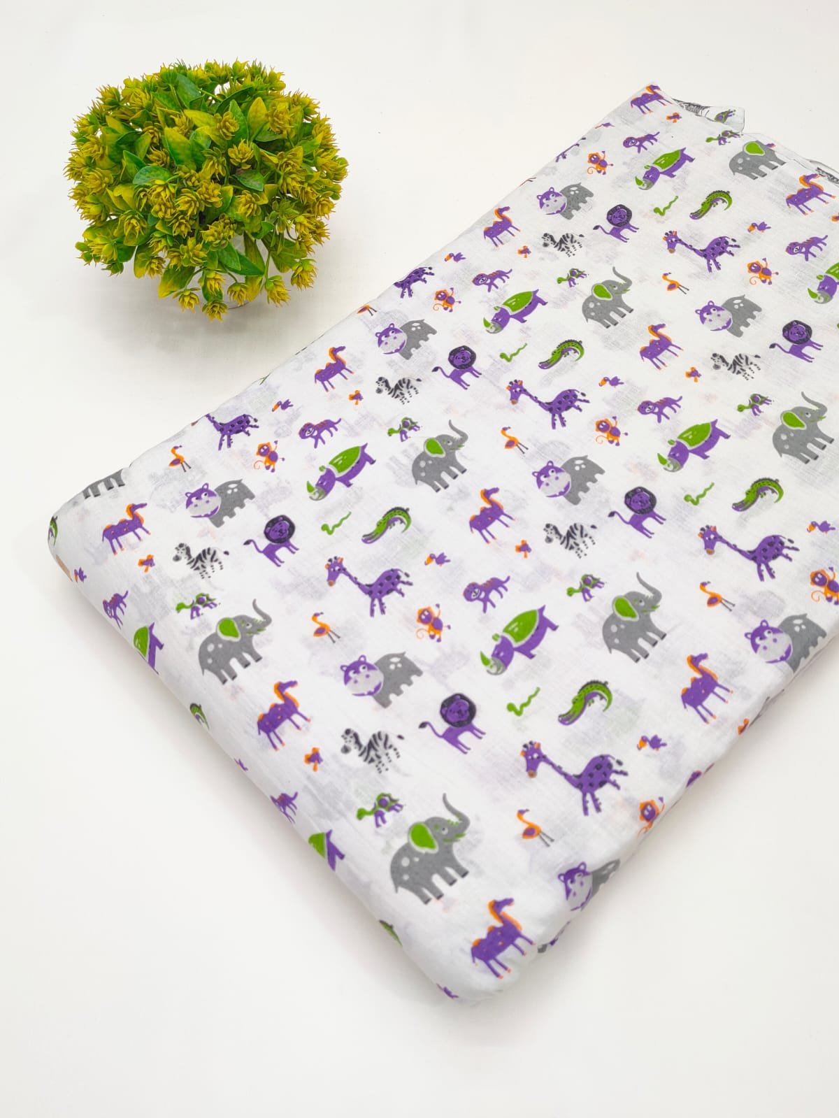 White vibrant animal print cotton fabric India