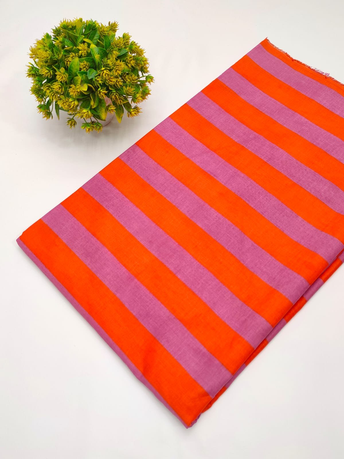 Orange and pink striped cotton fabric India