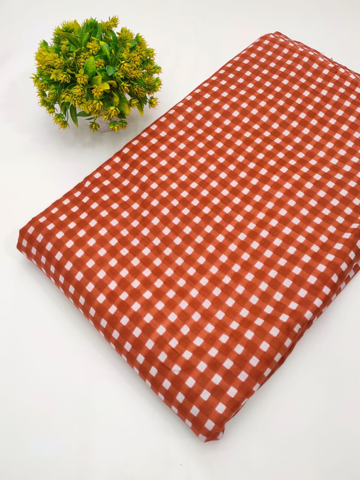 Rust gingham screen printed cotton fabric India